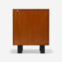 Cabinet, model 4702 by George Nelson & Associates, c. 1951, walnut and ebonized wood, aluminum, sold Feb 2024