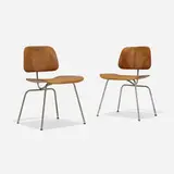 DCMs, pair by Charles and Ray Eames, aniline-dyed birch plywood, chrome-plated steel, rubber, sold Feb 2024