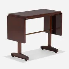 Drop-leaf serving cart by T. H. Robsjohn-Gibbings, c. 1950, mahogany, nickel-plated brass, casters, sold Feb 2024