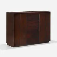 Vanity cabinet by Edward Wormley, c. 1955, mahogany, mirrored glass, glass, sold Feb 2024