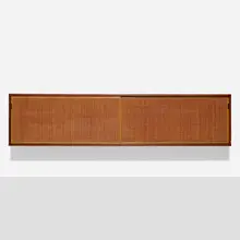 Florence Knoll, Wall cabinet, model 123, 1947, walnut veneer, rattan, maple, leather