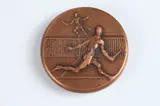 Guy-Charles Revol, Tennis, Bronze relief medallion Obverse: Two tennis players Reverse: Tennis ball