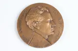Ulysse de Gemignani, Hommage to Maurice de Bus, Bronze relief medallion