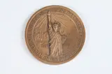 Frank Gasparro, Federal Hall, Bronze relief medallion Obverse: The Statue of Liberty Reverse: Federal Hall as it was as the nation's first Capitol building and as it is today
