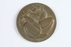 Jean De Marco, Clown, Bronze relief medallion The Society of Medalists 58th Issue-1958 Obverse: A clown playing on a flute Reverse: A lyre and the masks of comedy and tragedy