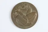 Jean De Marco, Clown, Bronze relief medallion The Society of Medalists 58th Issue-1958 Obverse: A clown playing on a flute Reverse: A lyre and the masks of comedy and tragedy