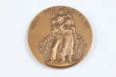 Carl C. Mose, This Is Our Heritage, Bronze relief medallion Obverse: Family standing before a field of wheat Reverse: Farmer rooting up a tree trunk