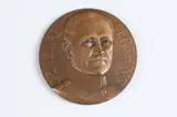 J. P. Legastelois, John J, Bronze relief medallion