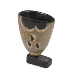John Maltby, Footed cup, Stoneware, of squeezed conical form on a rectangular block foot, mottled brown and grey glaze, against a black glaze