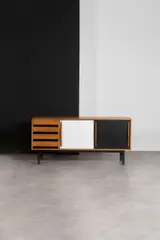 Mod. Cansado by Charlotte Perriand, Ash veneer, laminate and black lacquered metal, sold Jun 2023