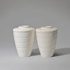 Keith Murray: Made by Wedgwood, Two vases, model no. 3805, circa 1935, Earthenware, "moonstone" glaze, conical and shouldered form with horizontal ridge decoration