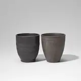 Two beakers by Keith Murray: Made by Wedgwood, circa 1935, Earthenware, matt black and brown basalt glaze, offered Feb 2023