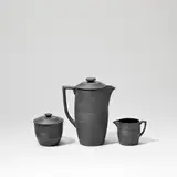 Three-piece coffee set by Keith Murray: Made by Wedgwood, circa 1935, Earthenware, matt black basalt glaze, ribbed exterior and gloss glazed interior, sold Feb 2023