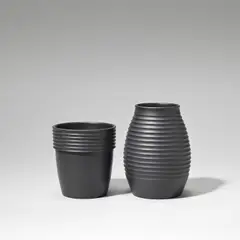 Keith Murray: Made by Wedgwood, Two vases, circa 1935, Earthenware, matt black basalt glaze, ribbed decoration