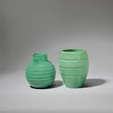 Two vases, model no.s 3801 and 3868 by Keith Murray: Made by Wedgwood, circa 1935, Earthenware, matt green glazes, sold Feb 2023