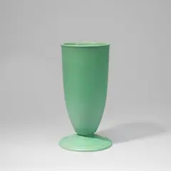 Keith Murray: Made, for Wedgwood, circa 1935, Earthenware, matt green glaze, cylindrical form tapering to a wide disc foot