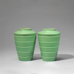 Keith Murray: Made by Wedgwood, Pair of vases, model no. 3805, circa 1935, Earthenware, green glaze, conical and shouldered form with horizontal ridge decoration