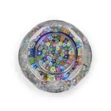 United Kingdom, late 20th century, faceted glass with canes in base and stopper, ht. 6 in. by Perthshire Art Glass Millefiori Bottle, United Kingdom, late 20th century, faceted glass with canes in base and stopper, ht, sold Oct 2023