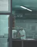 Serban Savu, Untitled (Worker through Shop Window)