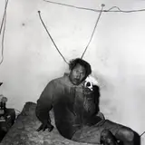 Roger Ballen, Man holding small puppy