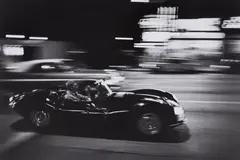 John Dominis, Steve McQueen driving his Jaguar at night, California, 1963, Gelatin silver print, printed