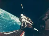 Nasa, Astronaut Richard Gordon attaches a tether line from the spacecraft to the Agena target docking vehicle, Gemini XI