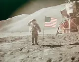 Nasa, Astronaut David R. Scott saluting beside U.S. flag, Apllo 15