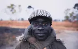 Jeff Widener, "Red Eyes", Cassinga, Angola, 2013, Chromogenic print
