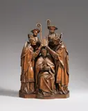 A high relief group showing the ordination of a Bishop, Antwerp, first quarter 16th century by Antwerp 1st quarter 16th century, Carved oak, the reverse flattened. The two flanking background figures are a separately worked older addition.. The scul, sold May 2014