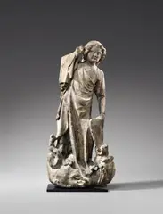 Lothringen, A figure of Saint Michael, Lorraine, circa 1320/1330, Sandstone, carved in the round whereby the reverse is carved in less detail. Minor remains of former polychromy. This fine quality sculpture is designed for a frontal viewpoint, but the fact that the sides are also carved in such detail indicates that it may have been originally placed before a wall or pillar. The saint is shown standing upon a dragon lain at his feet, which has sunk its teeth into his shield. Saint Michael is shown with his right hand raised, piercing his opponent with his now missing lance, a pose which emphasises the ponderation of his body. Cuts and old pins to the reverse indicate that the figure once bore separately worked wings. Christof Metzger has convincingly ascribed the sculpture to the Lorraine region and dates it to around 1320/1330, whereby he compares it to works from Metz, such as the Madonna in Saint-Dié Cathedral from around 1310/1320, the Madonna of Verdun from around 1315 (Berlin, Skulpturengalerie) and a fragment of a female saint's head from circa 1325 (Paris, Louvre). The right hand partially missing. Wear with minor losses, minor weathering to the surface. Mounted on a flat metal plinth