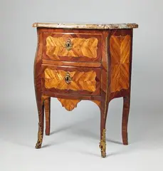 Jean-Georges Schlichtig, A Parisian transition period bombe-form chest of drawers, Kingwood, rosewood and maple on oak, fire-gilt bronze mountings, replaced iron locks, associated restored marble top. Stamped to the side apron: JME Schlichtig. Some bronze mountings missing, retouched damage due to earlier insect infestation. H 117, W 70, D