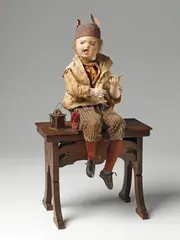 Gustave Vichy, Musical automaton "Jean qui pleure", Wind-up mechanism, plays two melodies, attached original key and locking button. Painted wood and papier mache head, glass eyes, porcelain hands, hair, textile, wood and metal. The left leg, right arm and head move to the music. With a metal plaque reading "Fabrique G. Vichy Modèle déposé" to the back of the bench. Soiled, one of the donkey's ears partially torn off, the clothing damaged. H ca