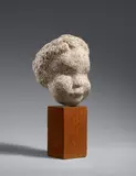 Joachim Utech, Kinderkopf, 1932, Granite sculpture on a wooden base