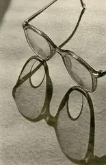 Glasses made of Bifokal glass by Max Baur, Ferrotyped gelatin silver print on Agfa-Portriga-Rapid paper, printed 1940s, sold May 2012