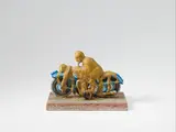 Dieter Roth, Motorradfahrer (motorcyclist), Tin toy, poured over with acrylic colour, mounted on wooden base, overall dimension ca