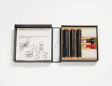 Dieter Roth, Stempel Theke (stamp bar), 12 different stamps, 2 stamp pad and 2 bottles with red and black ink and 2 double sheets with text and illustrations as instruction for use in linen cassette (with traces of age)