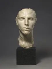 Arno Breker, Romanichel, Steinguß (Marmormehl, mit Kunstharz gebunden), elfenbeinfarben. Höhe 30 cm. Auf anthrazitfarbenem polierten Marmorsockel (