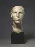 Arno Breker, Romanichel, Steinguß (Marmormehl, mit Kunstharz gebunden), elfenbeinfarben. Höhe 30 cm. Auf anthrazitfarbenem polierten Marmorsockel (