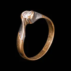A Bypass Diamond Ring in 14k, Untitled, The ring is designed with a bypass band, centered by a diamond weighing approximately 0.25 cts. <br><br> Weighs 3.90 g. <br><br> The diamond noted as Pass on the GIA iD100®