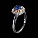 Untitled by A Royal Blue Sapphire Ring in 18k, The ring in 18k white gold is centered by a cushion-shaped Royal Blue sapphire weighing 1.08 cts, framed by a halo of di, sold Apr 2026