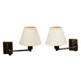 Untitled by A Pair of Articulated Wall Sconces, each<br> body:<br> H: 17” (43 cm)<br> L: 5” (13 cm)<br> W: 3 3/4” (10 cm), sold Apr 2026