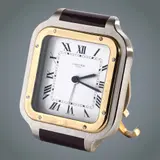 Cartier Santos De Cartier Desk Clock, Untitled, Movement • Movement Type: Quartz (battery powered) Case & Dimensions • Case Material: Stainless steel with yellow gold accents (bi-colour steel and gold) • Shape: Rectangular, styled after Santos de Cartier wristwatch theme • Approx. Dimensions: ~72 mm × 88 mm × 60 mm (Height × Width × Depth) • Crystal: Sapphire crystal (front) • Dial: White dial with black Roman numerals • Bezel: Stainless steel and yellow-gold two-tone • Water Resistance: Not water-resistant