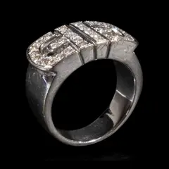 A Diamond Ring in 18k, Untitled, The thick band ring features diamonds weighing approximately 0.64 cts. <br> The piece is hallmarked 750. <br> Some stones noted as Refer on the GIA iD100®
