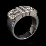 A Diamond Ring in 18k, Untitled, The thick band ring features diamonds weighing approximately 0.64 cts. <br> The piece is hallmarked 750. <br> Some stones noted as Refer on the GIA iD100®