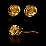 Untitled by A Set of 1980's Givenchy Rose Accessories, The set comprises of gold-plated rose earrings and a long-stem rose brooch. <br><br> Signed Paris New York Givenchy with, sold Jan 2026