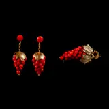 Untitled by A Set of Coral Jewelry, The set comprises of a gold-plated silver brooch and French screw-back dangling earrings each designed as clusters of gr, sold Jan 2026
