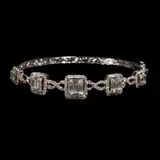 A Diamond Bangle in 18k, Untitled, A bangle in 18k white gold featuring illusion- set diamonds weighing approximately 3.00 cts.