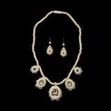 Untitled by A Set of Carved Bone Jewelry, The set includes a 16-inch necklace and matching earrings, meticulously carved from bone with intricate nature motifs., sold Jan 2026