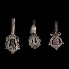 Untitled by A Set of Silver Châtelaine Clips, The set comprises of three silver châtelaine clips designs with intricate floral wreath motifs. <br><br> A châtelaine be, sold Jan 2026
