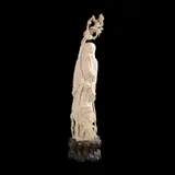 Untitled by A carved ivory image of Shoulao mounted on a wooden base, sold Jan 2026